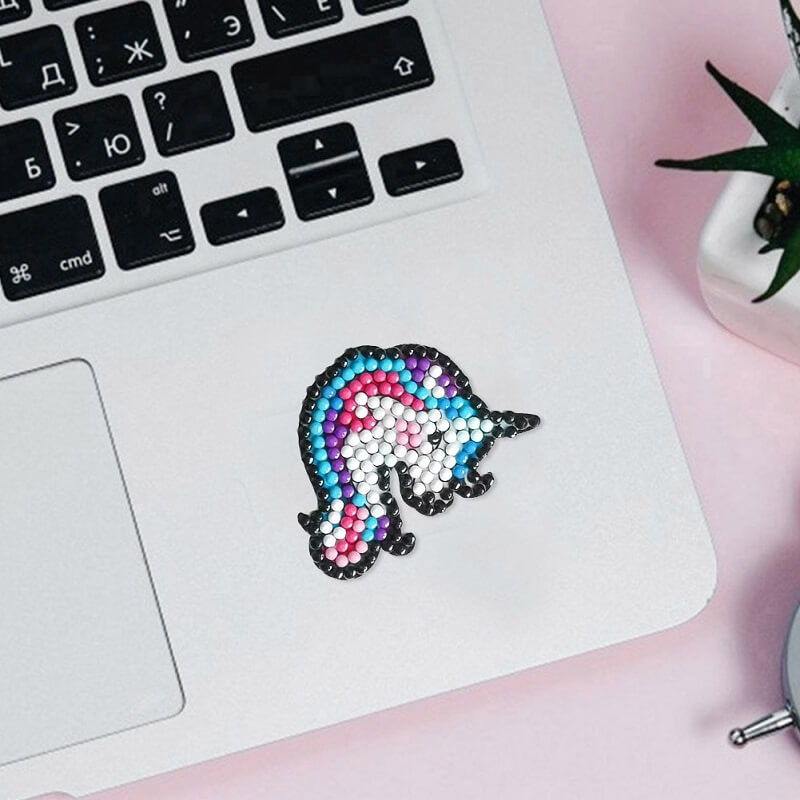 the laptop has a unicorn diamond painting sticker.